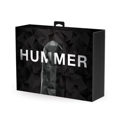 A sleek black box with a geometric design boldly displays HUMMER in white letters. The VeDO Hummer Transform Your BJ Masturbator features advanced mech-BJ technology, and the bottom showcases the VeDO logo beside a smaller product image.